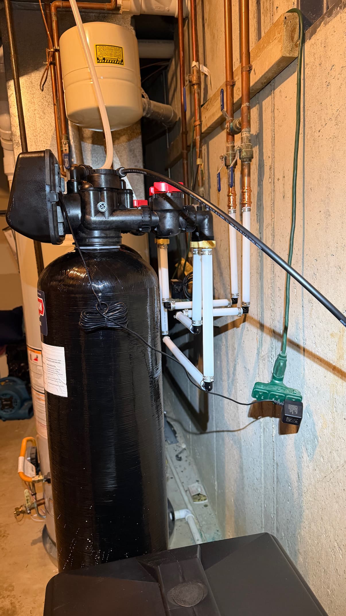 Water softener installation in a basement utility room